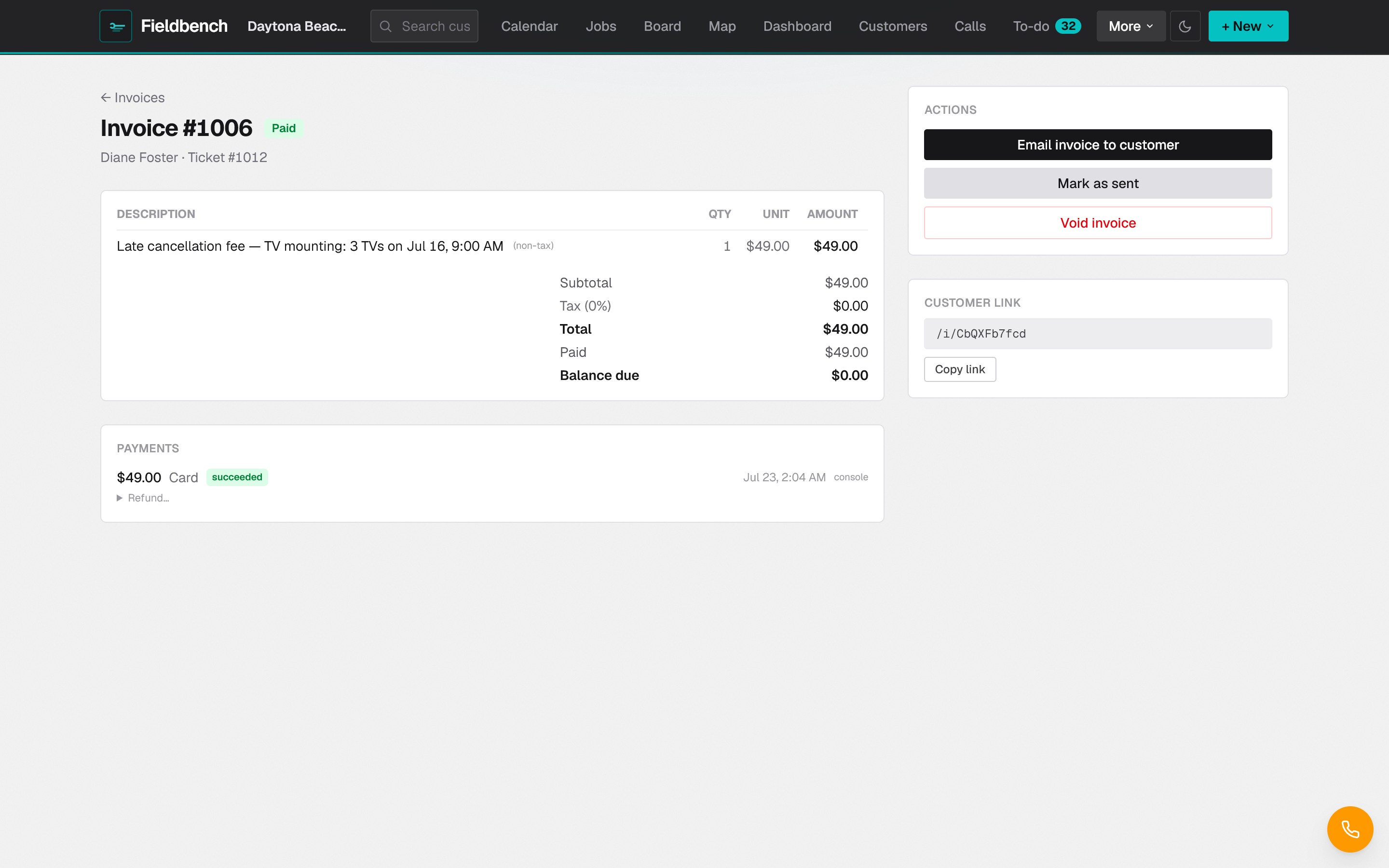 A paid invoice with line items, totals, and a card payment